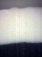 Obr. 16: Detailní snímek kryté části zkušebního vzorku – příčný řez